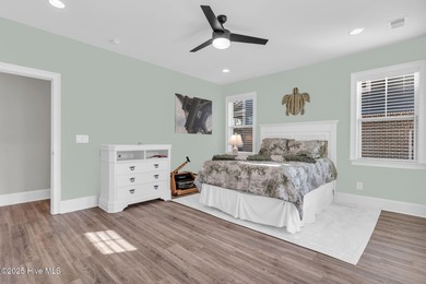 Coastal luxury meets low-maintenance living in this beautifully