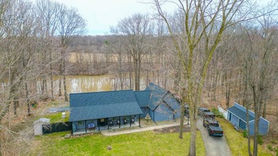 Discover this Cedar ranch walkout home set along the St. Joseph - photo 1