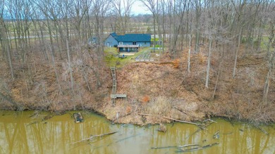 Discover this Cedar ranch walkout home set along the St. Joseph - photo 2