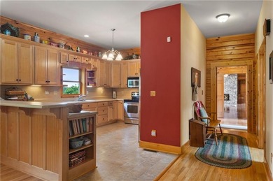 Welcome home to this custom builder's retreat with metal roof &