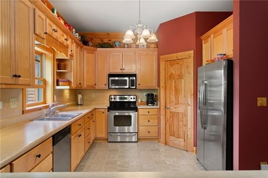 Welcome home to this custom builder's retreat with metal roof &