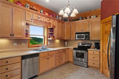 Welcome home to this custom builder's retreat with metal roof &