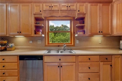 Welcome home to this custom builder's retreat with metal roof &