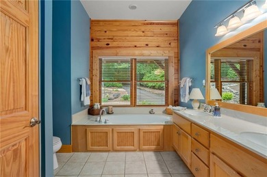 Welcome home to this custom builder's retreat with metal roof &