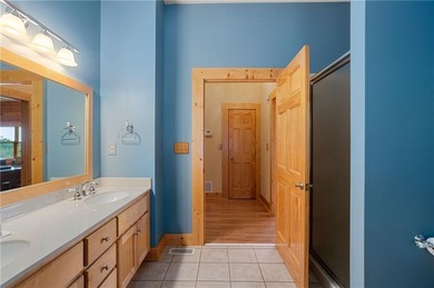 Welcome home to this custom builder's retreat with metal roof &