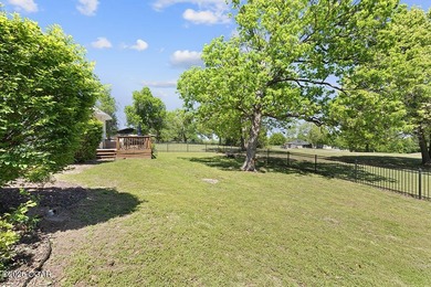 Nestled along the 13th hole of the prestigious Eagle Creek Golf - photo 46