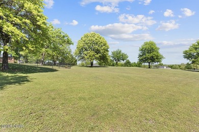 Nestled along the 13th hole of the prestigious Eagle Creek Golf - photo 49