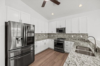 Welcome to this stunning remodeled 4-bedroom, 2.5-bathroom - photo 6