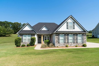 Nestled on 1.58 acres in a gated waterfront community, this - photo 1