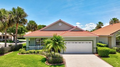 Situated on a large corner lot with lush tropical landscaping - photo 1