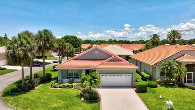 Situated on a large corner lot with lush tropical landscaping - photo 2