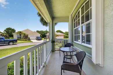 Situated on a large corner lot with lush tropical landscaping - photo 4