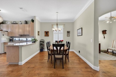 Situated on a large corner lot with lush tropical landscaping - photo 8