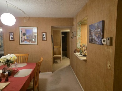 COZY AND SPACIOUS 2ND FLOOR CORNER UNIT BACKED UP ON GOLF COURSE - photo 4
