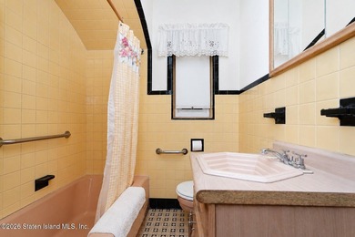 A detached two family home set on an expansive, street to street - photo 18