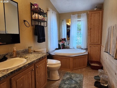 Tucked away among the trees on 1.16 private acres with a Large - photo 14