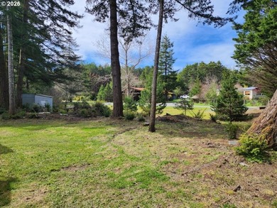 Tucked away among the trees on 1.16 private acres with a Large - photo 26