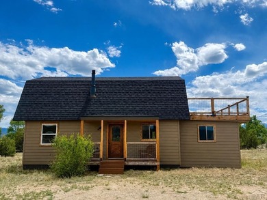 Perched on 9 scenic acres just minutes from Salida, this - photo 1