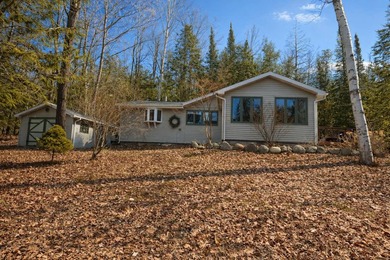 Tucked away in the heart of Up North Michigan, this charming - photo 2