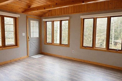 Tucked away in the heart of Up North Michigan, this charming - photo 3