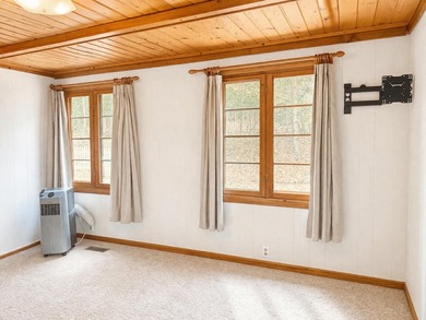 Tucked away in the heart of Up North Michigan, this charming - photo 10