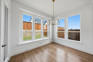 Popular open concept home features a dramatic two-story entry - photo 11