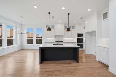 Popular open concept home features a dramatic two-story entry - photo 12