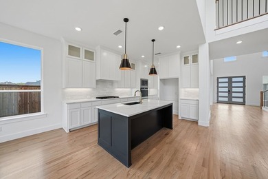 Popular open concept home features a dramatic two-story entry - photo 14