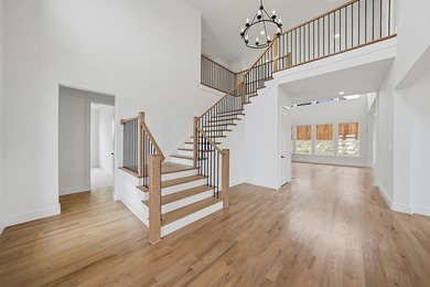 Popular open concept home features a dramatic two-story entry - photo 16