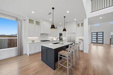 Popular open concept home features a dramatic two-story entry - photo 33