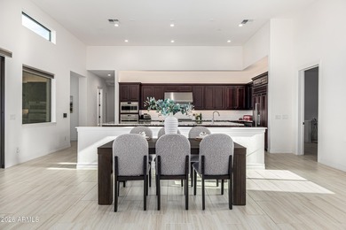 Set on a 1-acre site, this custom estate in the Boulder Ranch