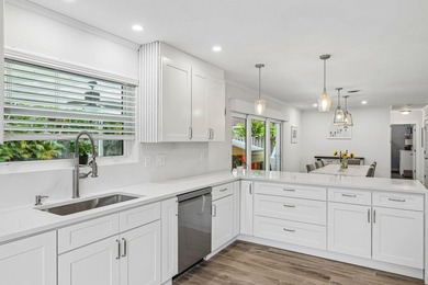Welcome to 500 SE 8th Avenue, a beautifully updated 2-bedroom - photo 5