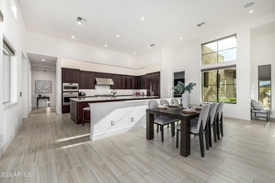 Set on a 1-acre site, this custom estate in the Boulder Ranch