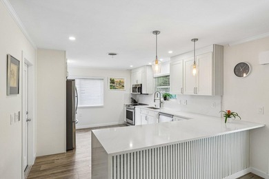 Welcome to 500 SE 8th Avenue, a beautifully updated 2-bedroom - photo 8