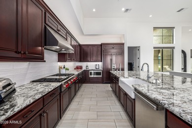 Set on a 1-acre site, this custom estate in the Boulder Ranch