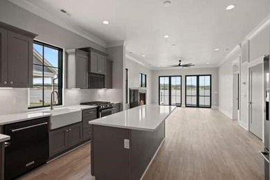 Experience panoramic lake living at its finest. This