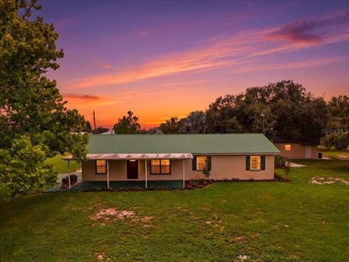 Tucked away off the beaten path, this exquisitely maintained - photo 1