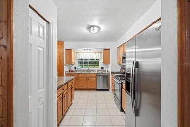 Tucked away off the beaten path, this exquisitely maintained - photo 10