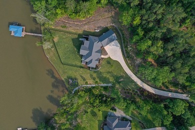 Positioned on a spectacular 2.4 acre lot with 267-foot lakefront - photo 2