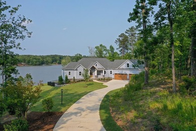 Positioned on a spectacular 2.4 acre lot with 267-foot lakefront - photo 3