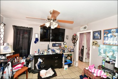 This well-maintained three-bedroom, one and three-quarter bath