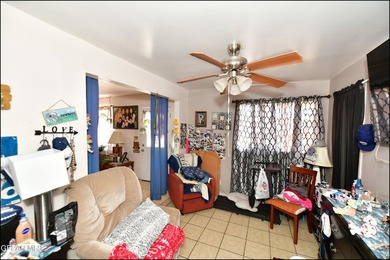 This well-maintained three-bedroom, one and three-quarter bath