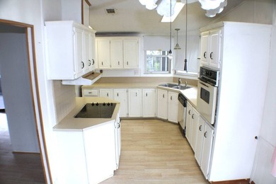 Enjoy the lake-view home on a corner lot and airy interior with - photo 12