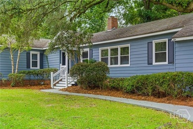 Nestled in the heart of Isle of Hope on large corner lot, this - photo 1