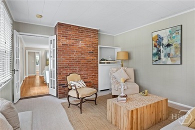 Nestled in the heart of Isle of Hope on large corner lot, this - photo 6