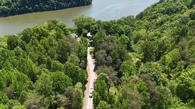 This 0.94+/- acre, wooded lot offers privacy and natural beauty - photo 3