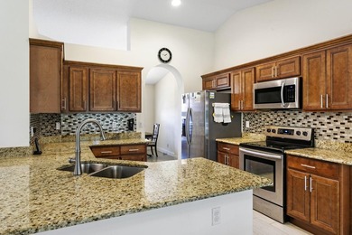 Nestled on a quiet street, this spacious CBS home is designed - photo 4