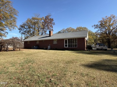 FOR COMP. 3-bedroom, 2-full-bath, one-story brick ranch with