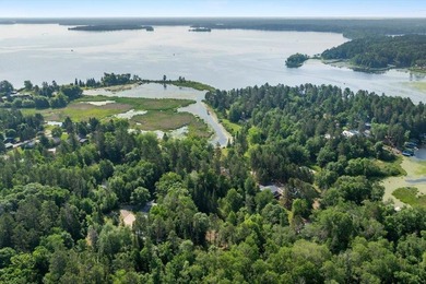 Nestled among mature pines and along a peaceful channel, the - photo 12