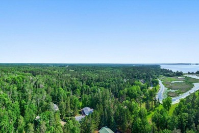 Nestled among mature pines and along a peaceful channel, the - photo 14